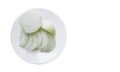 Top view onion is sliced Ã¢â¬â¹Ã¢â¬â¹on a white ceramic plate on white background, vegetables, food copy space